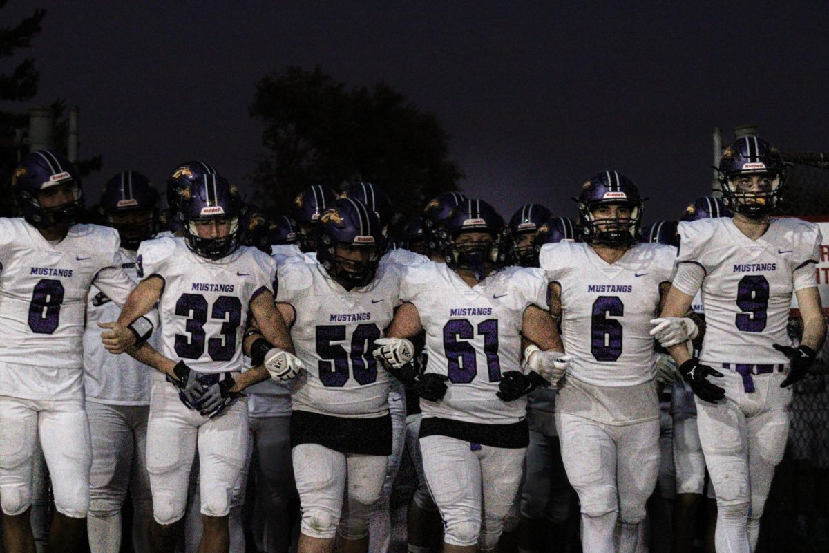 Mustang Varsity Football Marches on the Field